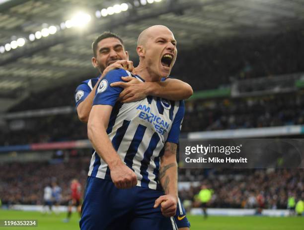 Aaron Mooy of Brighton & Hove Albion celebrates with Neal Maupay after scoring his teams second goal during the Premier League match between Brighton...