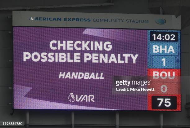 Checks for handball during the Premier League match between Brighton & Hove Albion and AFC Bournemouth at American Express Community Stadium on...