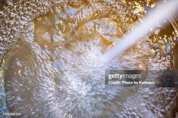 water flowing into a large pot - rainwater basin stock pictures, royalty-free photos & images