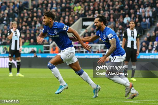 Dominic Calvert-Lewin of Everton celebrates with teammate Theo Walcott of Everton after scoring his team's first goal during the Premier League match...