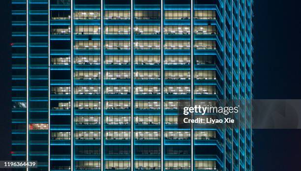office building at night - energy efficient building stock pictures, royalty-free photos & images
