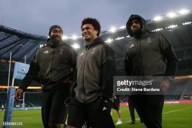 Tevita Cavubati, Elia Elia and Semi Kunabuli Kunatani of Harlequins make their way off the pitch after arriving at the ground prior to to the...