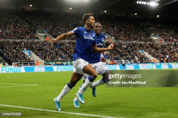 Dominic Calvert-Lewin of Everton celebrates with teammate Djibril Sidibe after scoring his team's second goal during the Premier League match between...