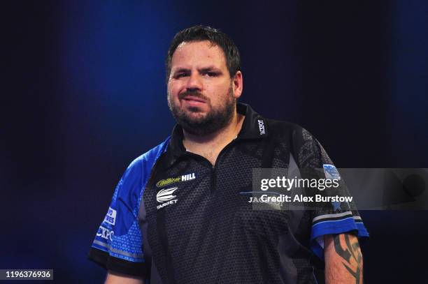 Adrian Lewis of England reacts in his Fourth Round match against Dimitri Van den Bergh of Belgium during Day Thirteen of the 2020 William Hill World...