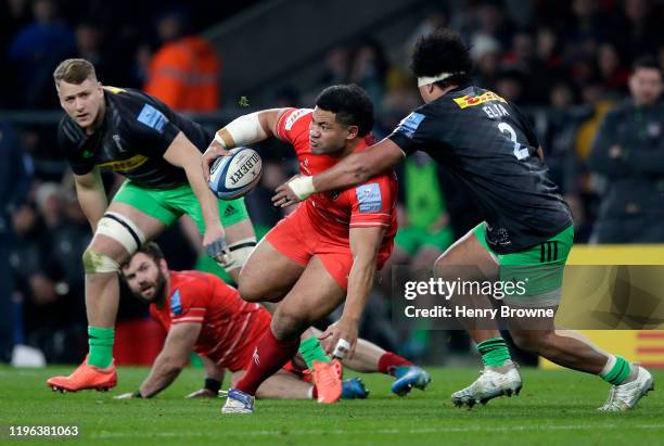 Tatafu Polota-Nau of Leicester Tigers is tackled by Elia Elia of Harlequins during the Gallagher Premiership Rugby Big Game 12 match between...