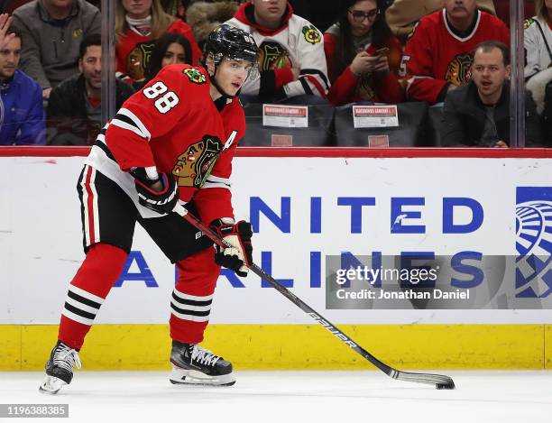 Patrick Kane of the Chicago Blackhawks looks to pass against the New York Islanders at the United Center on December 27, 2019 in Chicago, Illinois....