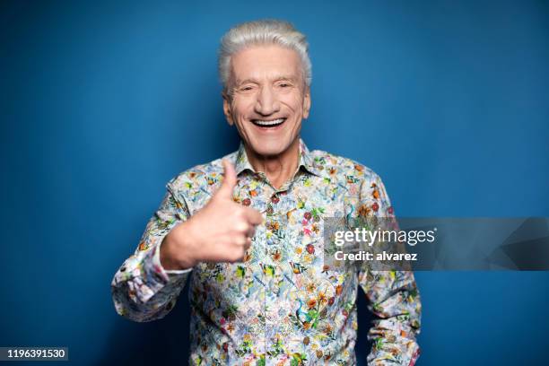 portrait of a senior man giving thumbs up - gesturing ok stock pictures, royalty-free photos & images