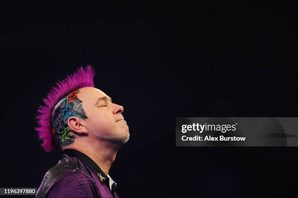 Peter Wright of Scotland reacts after winning his Fourth Round match against Jeffrey de Zwaan of The Netherlands during Day Thirteen of the 2020...