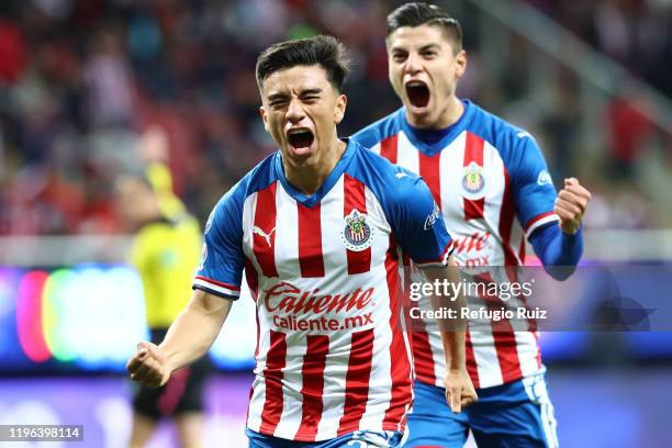 Fernando Beltrán of Chivas celebrates with his teammates after scoring the first goal of his team during the 3rd round match between Chivas and...