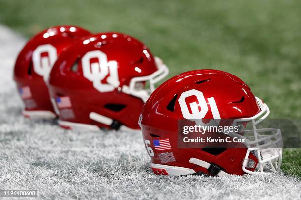 Oklahoma Sooners helmets are seen prior to the Chick-fil-A Peach Bowl between the LSU Tigers and the Oklahoma Sooners at Mercedes-Benz Stadium on...