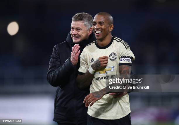 Manchester United Manager Ole Gunnar Solskjaer celebrates with Ashley Young following their sides victory in the Premier League match between Burnley...