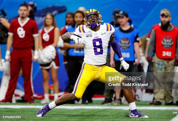 Linebacker Patrick Queen of the LSU Tigers celebrates a defensive play against the Oklahoma Sooners during the Chick-fil-A Peach Bowl at...
