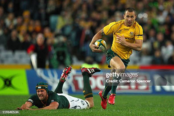 Quade Cooper of the Wallabies makes a break during the Tri-Nations match between the Australian Wallabies and the South African Springboks at ANZ...