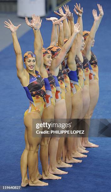 Britain's synchronised swimming team wave after their routine in the final of the team free synchronised swimming competition in the FINA World...