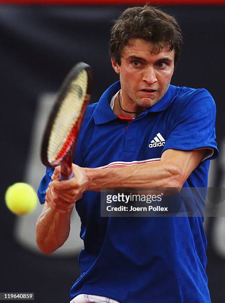 Gilles Simon of France returns a backhand during his semi final match against Mikhail Youzhny of Russia during the bet-at-home German Open Tennis...