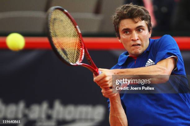 Gilles Simon of France returns a backhand during his semi final match against Mikhail Youzhny of Russia during the bet-at-home German Open Tennis...