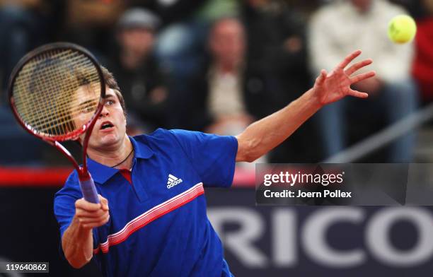 Gilles Simon of France returns a forehand during his semi final match against Mikhail Youzhny of Russia during the bet-at-home German Open Tennis...