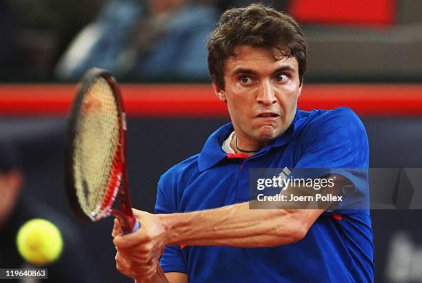 Gilles Simon of France returns a backhand during his semi final match against Mikhail Youzhny of Russia during the bet-at-home German Open Tennis...