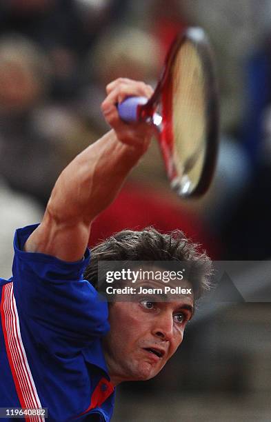 Gilles Simon of France serves during his semi final match against Mikhail Youzhny of Russia during the bet-at-home German Open Tennis Championships...