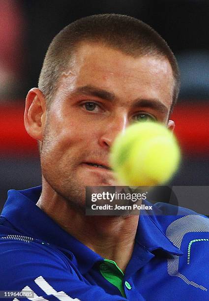 Mikhail Youzhny of Russia returns a backhand during his semi final match against Gilles Simon of France during the bet-at-home German Open Tennis...