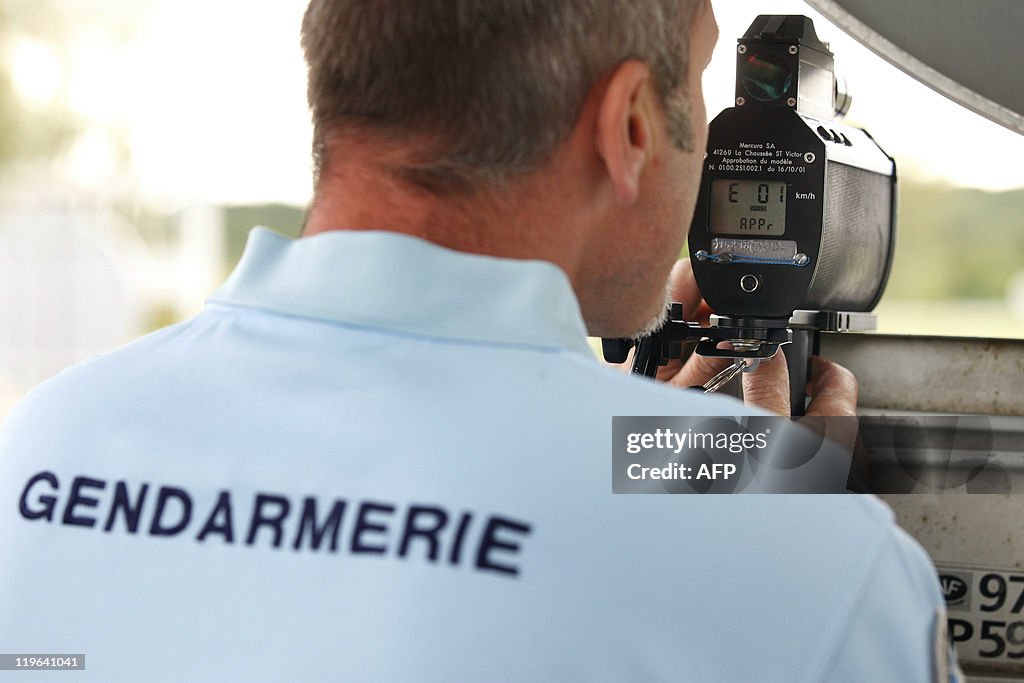 A Gendarme controls the speed of the dri