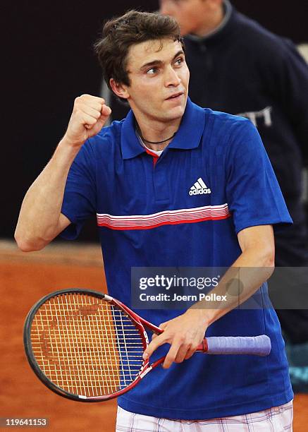 Gilles Simon of France celebrates after winning his semi final match against Mikhail Youzhny of Russia during the bet-at-home German Open Tennis...