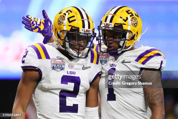 Wide receiver Justin Jefferson of the LSU Tigers and Ja'Marr Chase celebrates a touchdown over the Oklahoma Sooners in the second quarter during the...