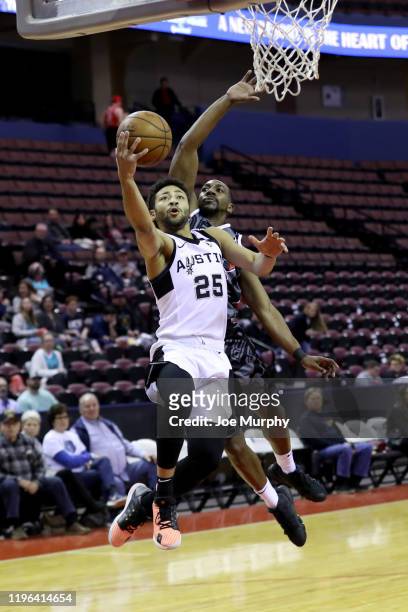 Galen Robinson Jr. #25 of the Austin Spurs drives to the basket for a layup against Marquis Teague of the Memphis Hustle during an NBA G-League game...