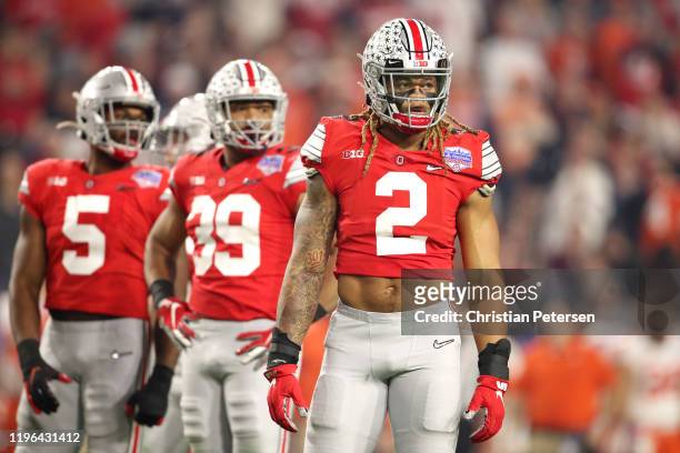 Chase Young of the Ohio State Buckeyes looks on against the Clemson Tigers in the first half during the College Football Playoff Semifinal at the...