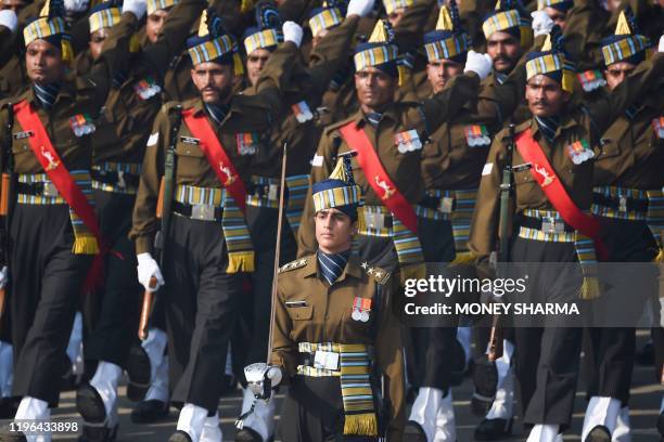 Indian Army captain Tania Shergill leads an all-male contingent as they march along Rajpath during the Republic Day parade in New Delhi on January...