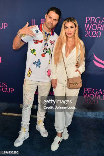 Alec Monopoly and Alexa Dellanos attend the 2020 Pegasus World Cup Championship Invitational Series at Gulfstream Park on January 25, 2020 in...