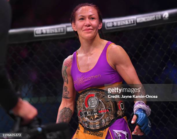 Cris Cyborg in the cage after defeating Julia Budd in their featherweight world title fight at The Forum on January 25, 2020 in Inglewood,...