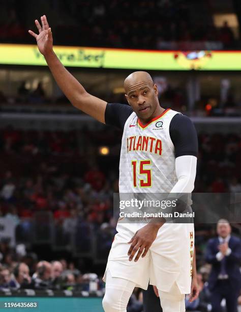 Vince Carter of the Atlanta Hawks acknowledges the crowd as he leaves his last game at the United Center against the Chicago Bulls at the United...