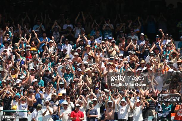 New Zealand fans enjoy the atmosphere during day four of the Second Test match in the series between Australia and New Zealand at Melbourne Cricket...