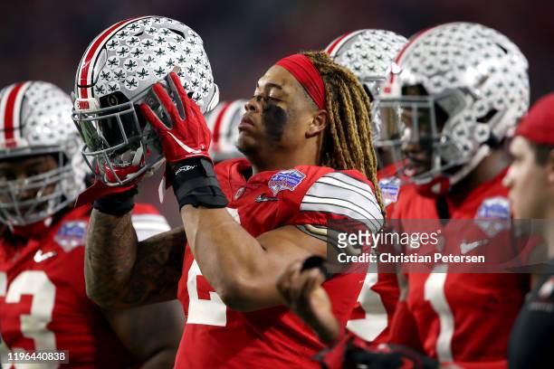 Chase Young of the Ohio State Buckeyes looks on against the Clemson Tigers in the first half during the College Football Playoff Semifinal at the...