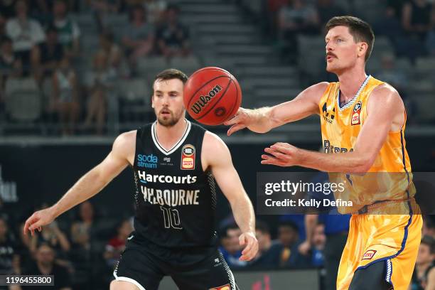 Cameron Gliddon of the Bullets passes during the round 13 NBL match between Melbourne United and the Brisbane Bullets at Melbourne Arena on December...