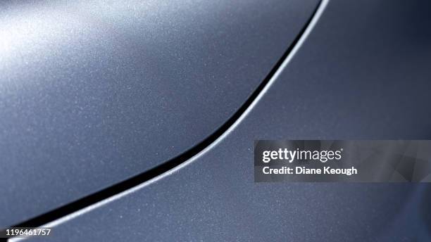 close up of the front side of a sedan - cofano foto e immagini stock