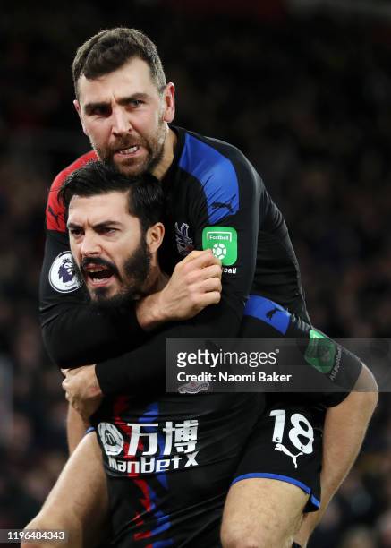 James Tomkins of Crystal Palace celebrates with James McArthur of Crystal Palace after he scores his sides first goal during the Premier League match...