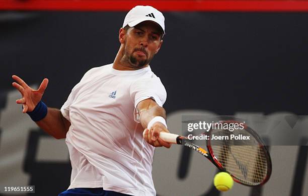 Fernando Verdasco of Spain returns a forehand during his semi final match against Nicolas Almagro of Spain during the bet-at-home German Open Tennis...