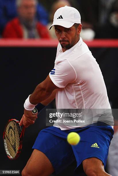 Fernando Verdasco of Spain returns a backhand during his semi final match against Nicolas Almagro of Spain during the bet-at-home German Open Tennis...