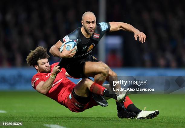 Olly Woodburn of Exeter Chiefs is tackled by Duncan Taylor of Saracens during the Gallagher Premiership Rugby match between Exeter Chiefs and...