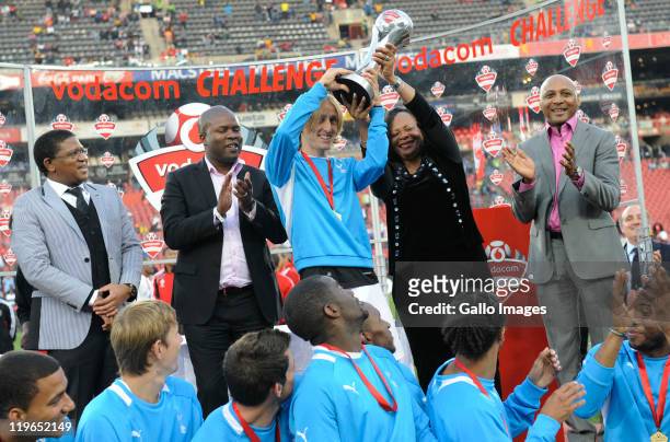 Luka Modric and Tottenham team-mates celebrate with the trophy, joined by South Africa's Minister of Sport Fikile Mbalula and Lebohang Maile, after...