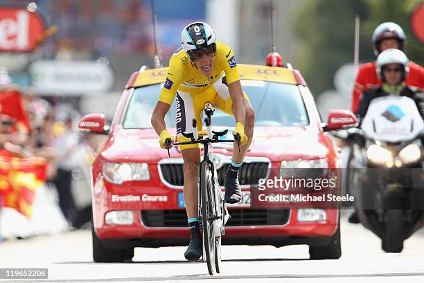 Andy Schleck of Luxemburg and Team Leopard-Trek grimaces as he crosses the finish line to lose the leaders yellow jersey with one stage remaining...