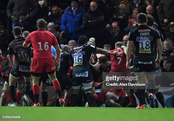 Fight breaks out during the Gallagher Premiership Rugby match between Exeter Chiefs and Saracens at Sandy Park Stadium on December 29, 2019 in...