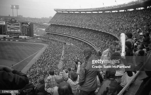 View of fans as they cheer during an opening day baseball game at Shea Stadium, in the Corona neighborhood of Queens, New York, New York, April 13,...