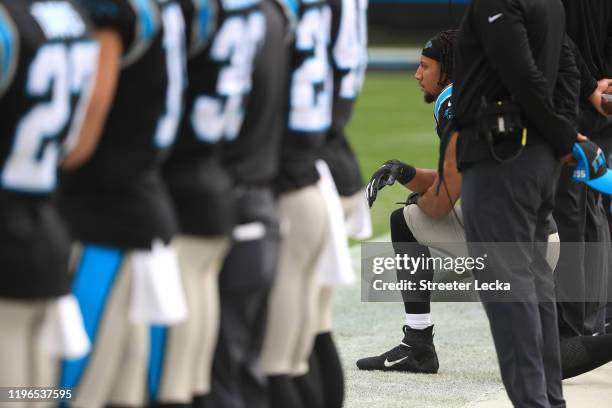 Eric Reid of the Carolina Panthers kneels during the singing of the National Anthem before their game against the New Orleans Saints at Bank of...