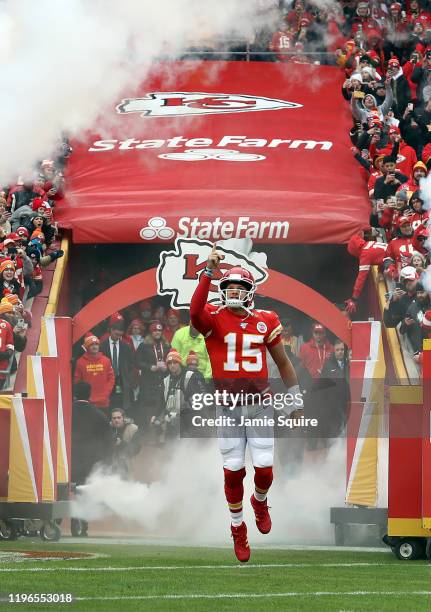 Quarterback Patrick Mahomes of the Kansas City Chiefs runs out of the tunnel as he is introduced prior to the game against the Los Angeles Chargers...