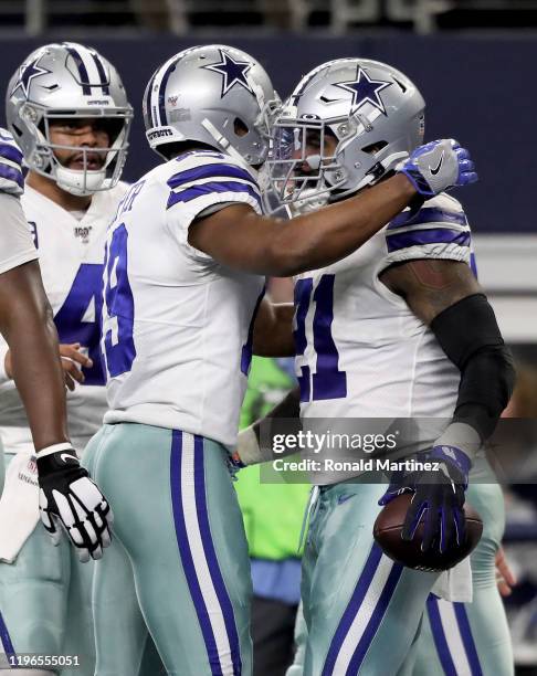 Amari Cooper and Ezekiel Elliott of the Dallas Cowboys celebrate after scoring a touchdown in the second quarter against the Washington Redskins in...