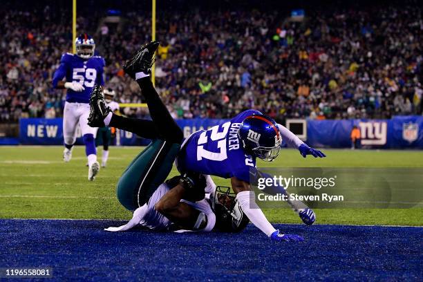 Josh Perkins of the Philadelphia Eagles catches a 24 yard touchdown pass against Deandre Baker of the New York Giants during the second quarter in...