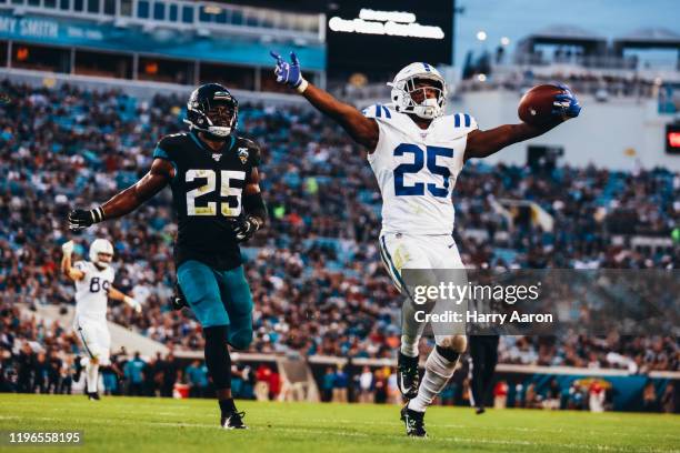 Marlon Mack of the Indianapolis Colts scores a touchdown against the Jacksonville Jaguars in the second quarter at TIAA Bank Field on December 29,...